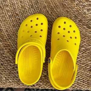 Lightly worn yellow classic Crocs (men’s size 5/women’s size 7)